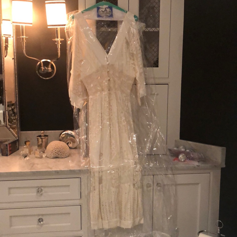 Cream tea length dress from Anthropologie